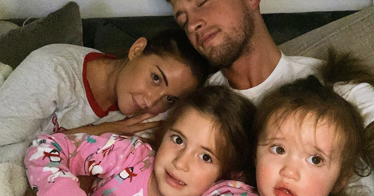 Jacqueline Jossa cuddles up to husband Dan Osborne and daughters Ella and Mia in loved-up Christmas Eve snap - www.ok.co.uk