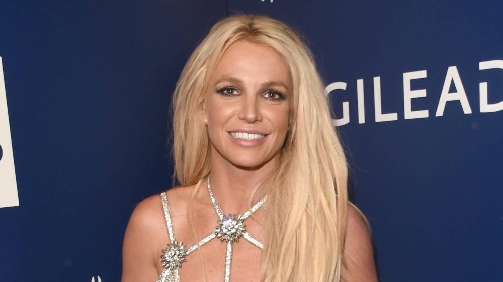 Britney Spears' snake-skin print bikini shows off new yoga body: 'Can't wait for spring!' - www.foxnews.com