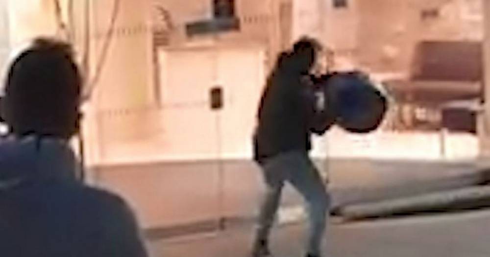 Video shows man hurling beer barrel through the front of Barclays Bank in Wigan town centre - www.manchestereveningnews.co.uk - city Wigan