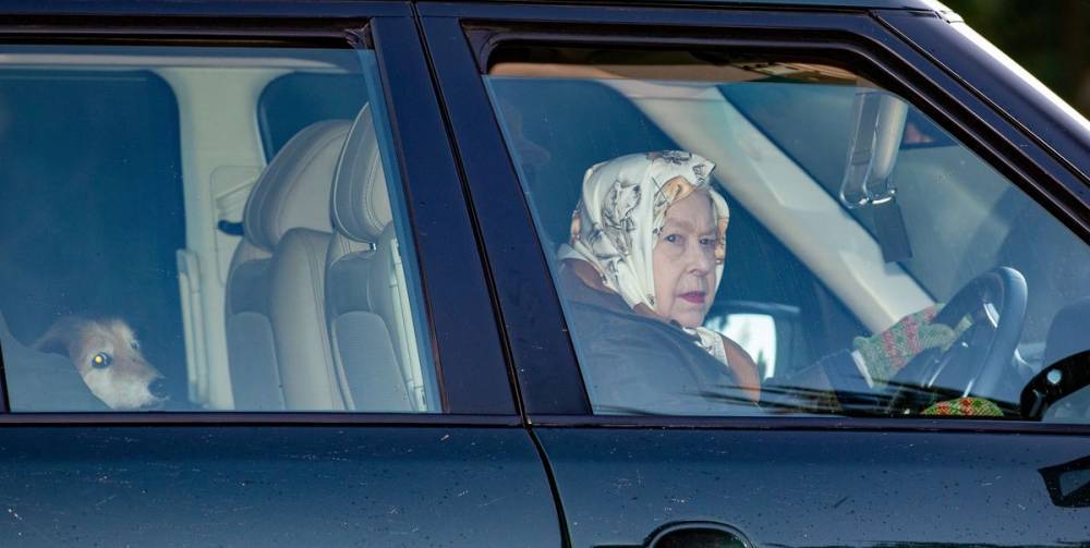 Queen Elizabeth II Rides Around Town with Her Dog and Dog-Print Headscarf - www.harpersbazaar.com - city Sandringham