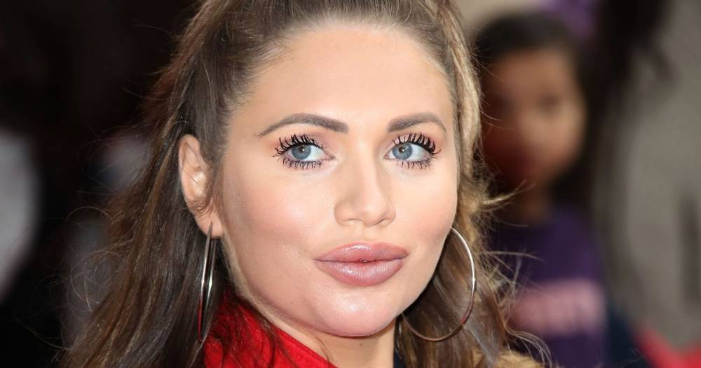 Amy Childs says her breast implant flipped over and burst as she opens up on her surgery addiction - www.ok.co.uk