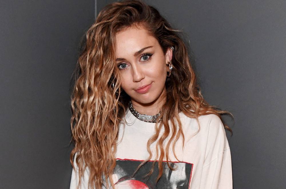 Miley Cyrus Spends a Day in Her Producer's Glittery Shoes: See the Pic - www.billboard.com