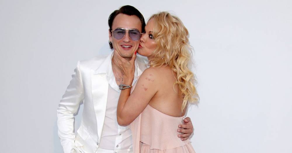 Pamela Anderson’s Son Brandon Thomas Lee Is ‘Incredibly’ Happy About Her Marriage to Jon Peters - www.usmagazine.com