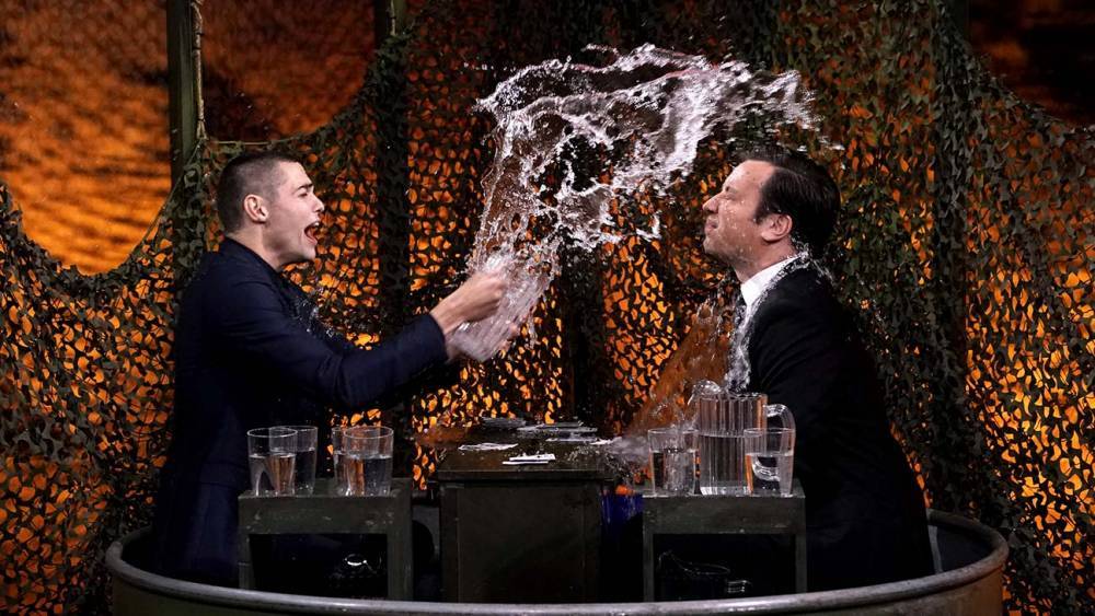 Noah Centineo and Jimmy Fallon Throw Water at Each Other in Heated "Water War" - www.hollywoodreporter.com