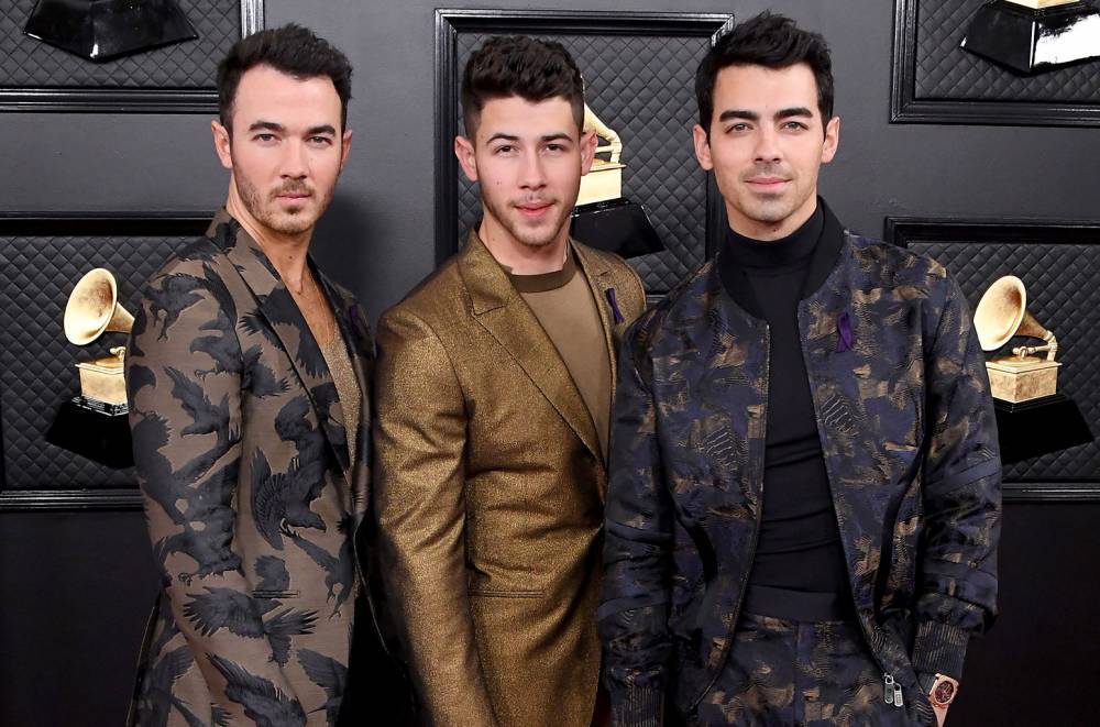 Jonas Brothers Hit the Grammys Red Carpet With the J-Sisters by Their Sides: See the Sweet Pics - www.billboard.com