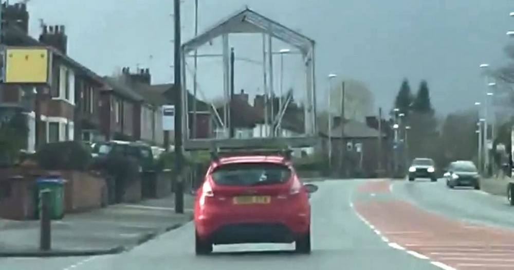 '£5 delivery? Jog on'... driver spotted with GREENHOUSE strapped to roof of car - www.manchestereveningnews.co.uk