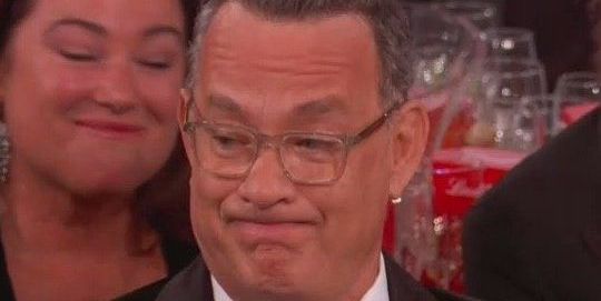 Tom Hanks' Face at the Golden Globes Is Officially 2020's Best Meme - www.harpersbazaar.com