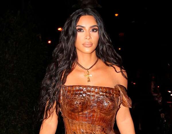 Kim Kardashian Strips Down for a "Little Late" New Year's Celebration - www.eonline.com