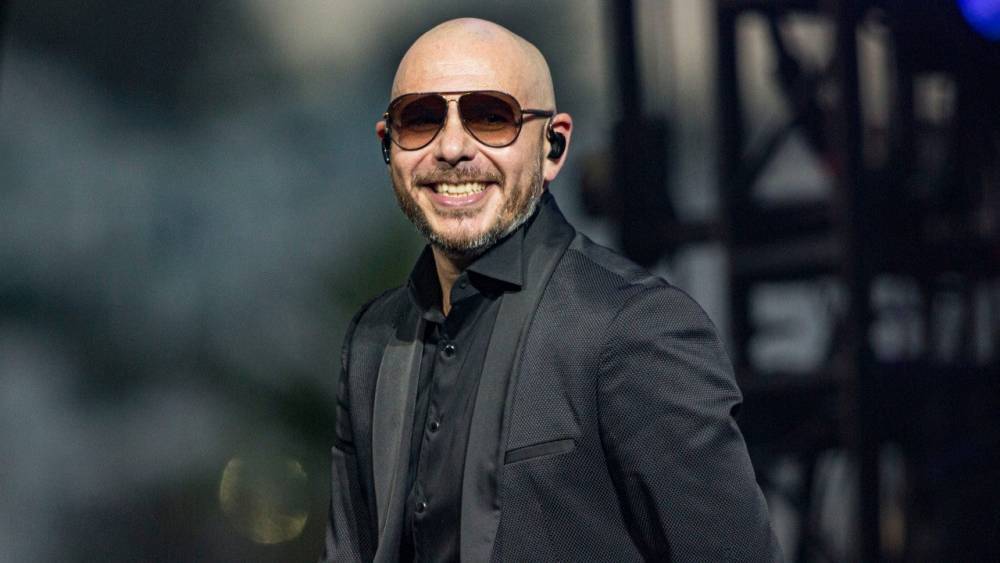 Pitbull Teases Appearance in Jennifer Lopez and Shakira's Super Bowl Halftime Show (Exclusive) - www.etonline.com