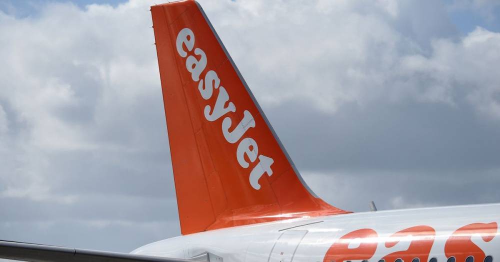 Easyjet warns passengers after coronavirus 'super spreader' flies to UK - www.manchestereveningnews.co.uk - Britain - Singapore