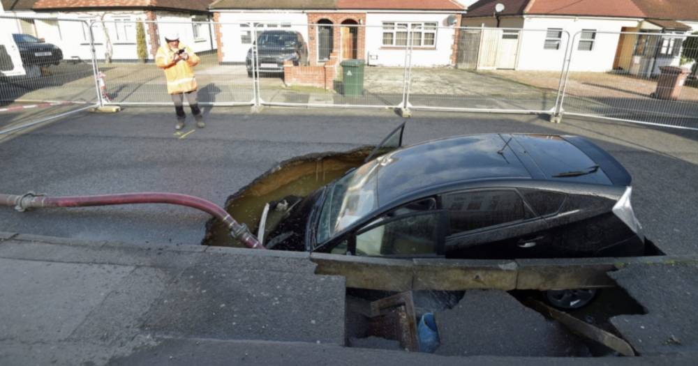 Storm Ciara chaos sees driver rescued as car swallowed by huge sinkhole - www.dailyrecord.co.uk