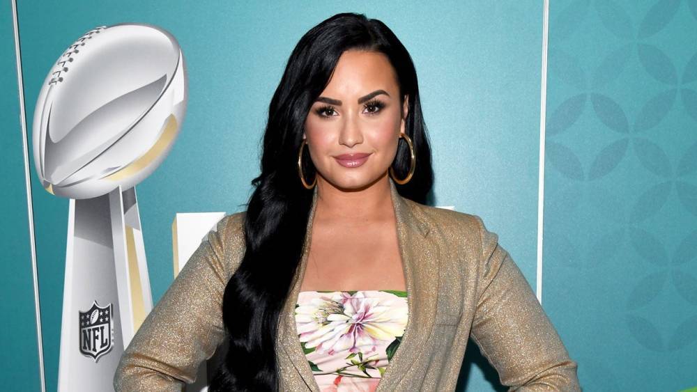 Demi Lovato Explains the Meaning Behind Her New Angel Tattoo - www.etonline.com