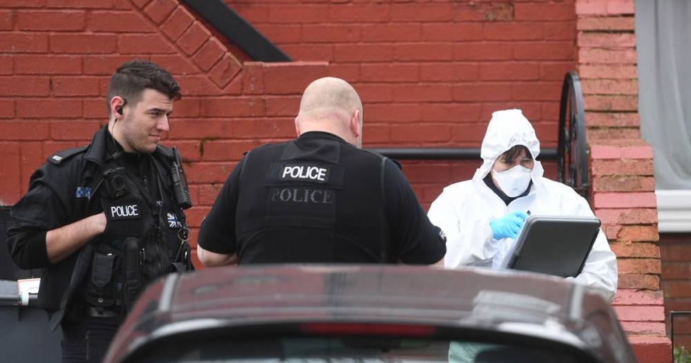 Woman rushed to hospital after police descended on her home dies - www.manchestereveningnews.co.uk - Manchester