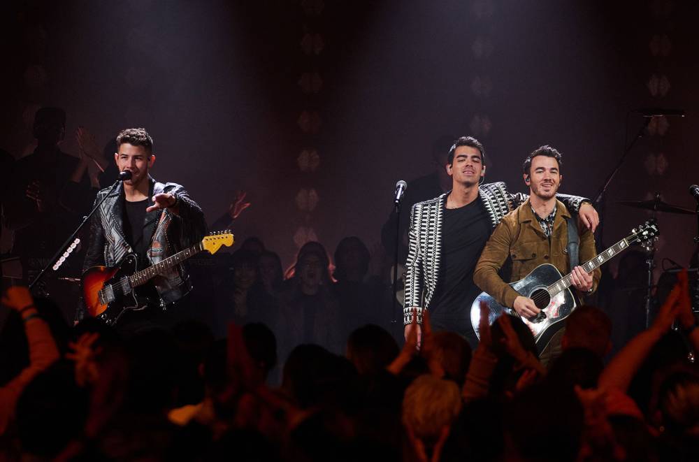 Watch The Jonas Brothers Tear Up 'Late Late Show' Stage With 'What a Man Gotta Do' - www.billboard.com