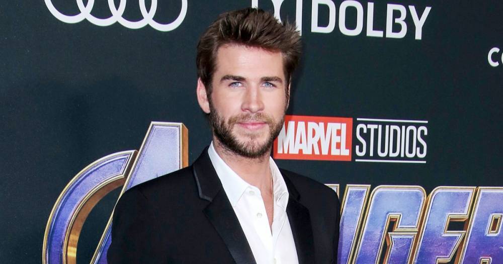 Liam Hemsworth Bares His Biceps in New Gym Photo: Working Out ‘Distracts’ Him From ‘Negativity’ - www.usmagazine.com - Australia