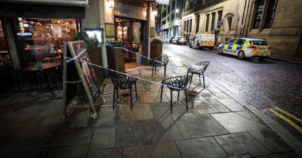 Police tape off city centre street and blood-spattered pavement outside All Bar One - www.manchestereveningnews.co.uk - Manchester
