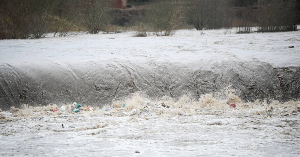 Storm Dennis takes out River Irwell bridge in Salford as heavy rain and strong winds hit the region - www.manchestereveningnews.co.uk - Britain - Manchester