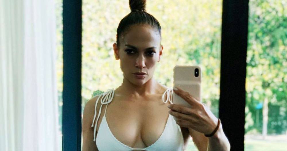Jennifer Lopez Shows Off Her Toned Abs in White Bikini: 'Relaxed and Recharged' - flipboard.com
