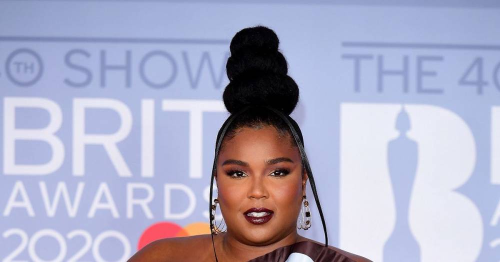 Lizzo steals show at Brit Awards in Hershey's chocolate wrapper dress - www.dailyrecord.co.uk - Scotland - London - USA - county Lewis