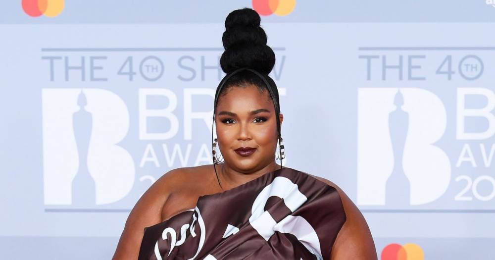 Lizzo Turns Heads in a Hershey Bar Moschino Dress at the 40th Annual Brit Awards - www.usmagazine.com - London