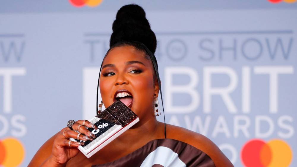 Lizzo Hits 2020 Brit Awards Red Carpet Dipped In Chocolate Bar Gown - flipboard.com - London