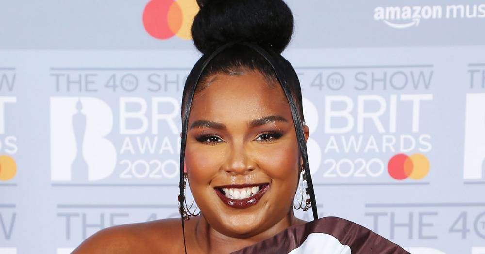 Lizzo Wears Chocolate-Scented Nail Polish With Hershey Dress at the 40th Annual Brit Awards - www.usmagazine.com - Poland