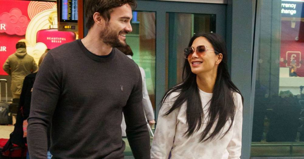 Nicole Scherzinger and Thom Evans look very loved-up as they return to UK from romantic Los Angeles trip - www.ok.co.uk - Britain - London - Los Angeles