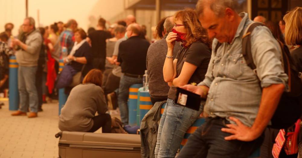 British tourists stranded by Saharan sandstorm in Canary Islands sleep on airport floors - www.dailyrecord.co.uk - Britain