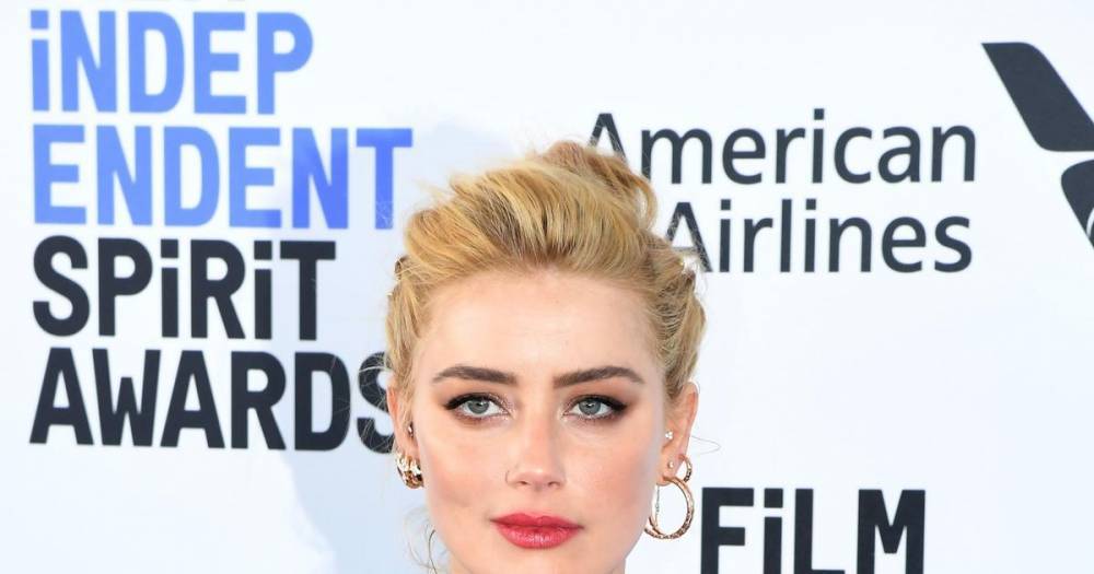 Backlash against Amber Heard intensifies after alleged abuse admission - www.wonderwall.com