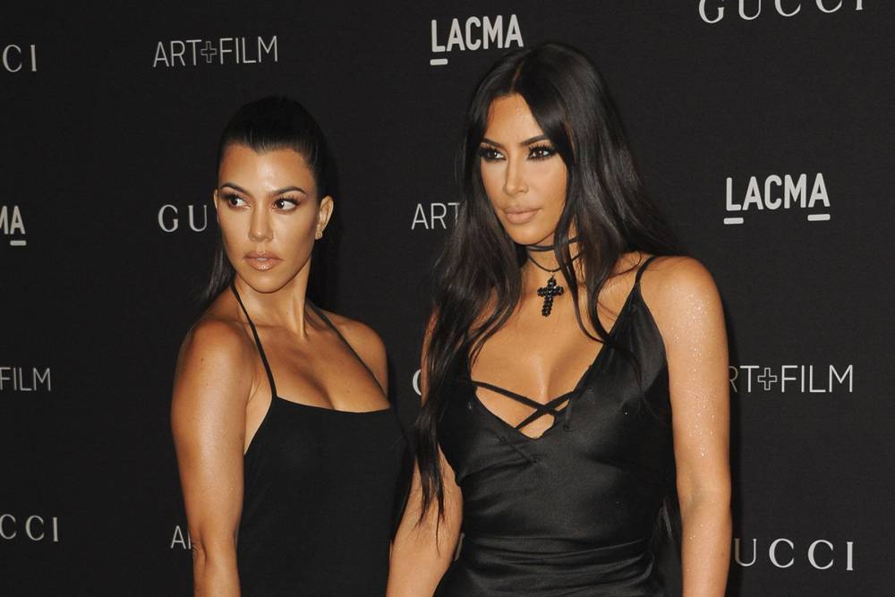 Kim Kardashian physically fights with sister Kourtney in Keeping Up with the Kardashians trailer - www.hollywood.com