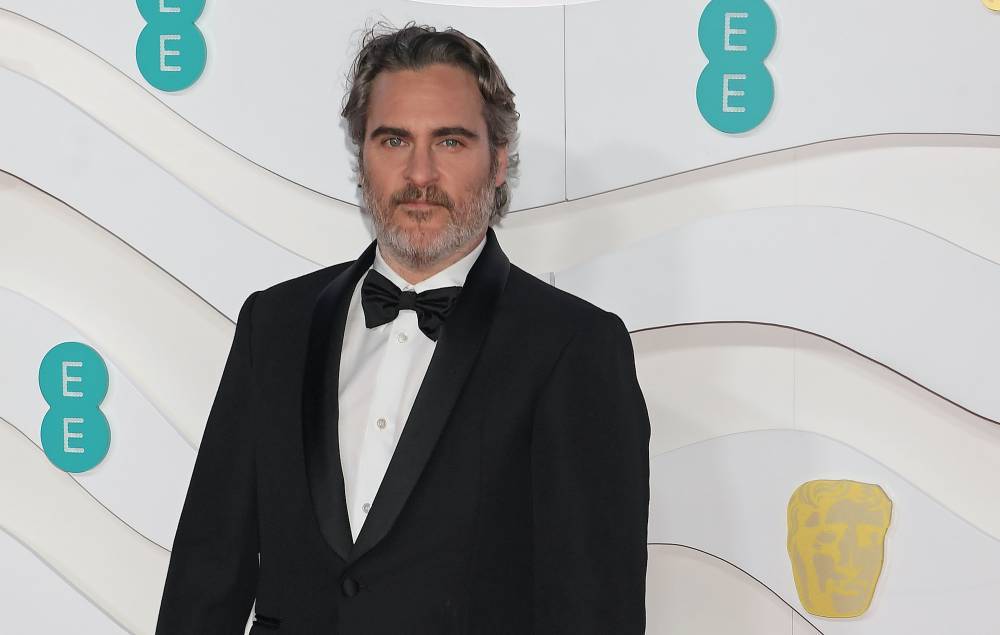 Joaquin Phoenix calls on film industry to dismantle “system of oppression” in BAFTAs speech - www.nme.com - London