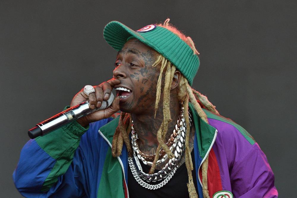 **SPOILER ALERT** Lil Wayne shocks The Masked Singer panel in season premiere reveal - www.hollywood.com