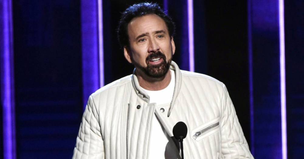 Nicolas Cage Packs on PDA With Mystery Woman at Independent Spirit Awards - www.usmagazine.com - California - Las Vegas