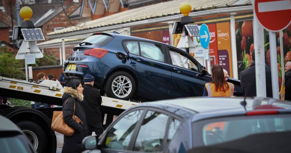 Patient taken to hospital after car smashes into column outside Sainsbury's in Trafford - www.manchestereveningnews.co.uk