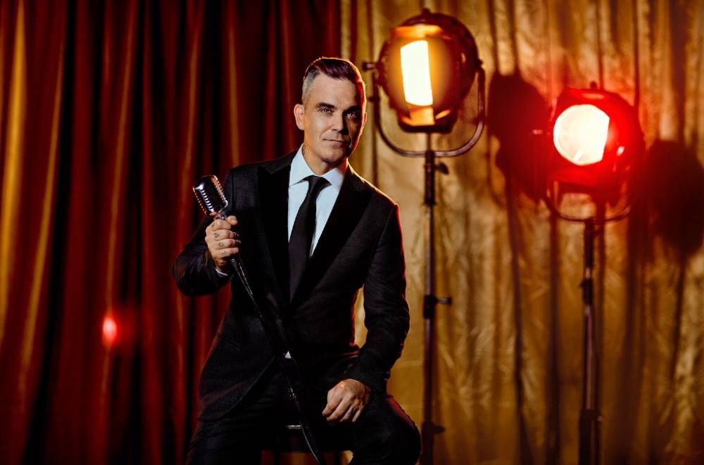 Robbie Williams on Returning to Las Vegas & Why Nobody Says No to Taylor Swift - www.billboard.com - Britain - Las Vegas - city Sin