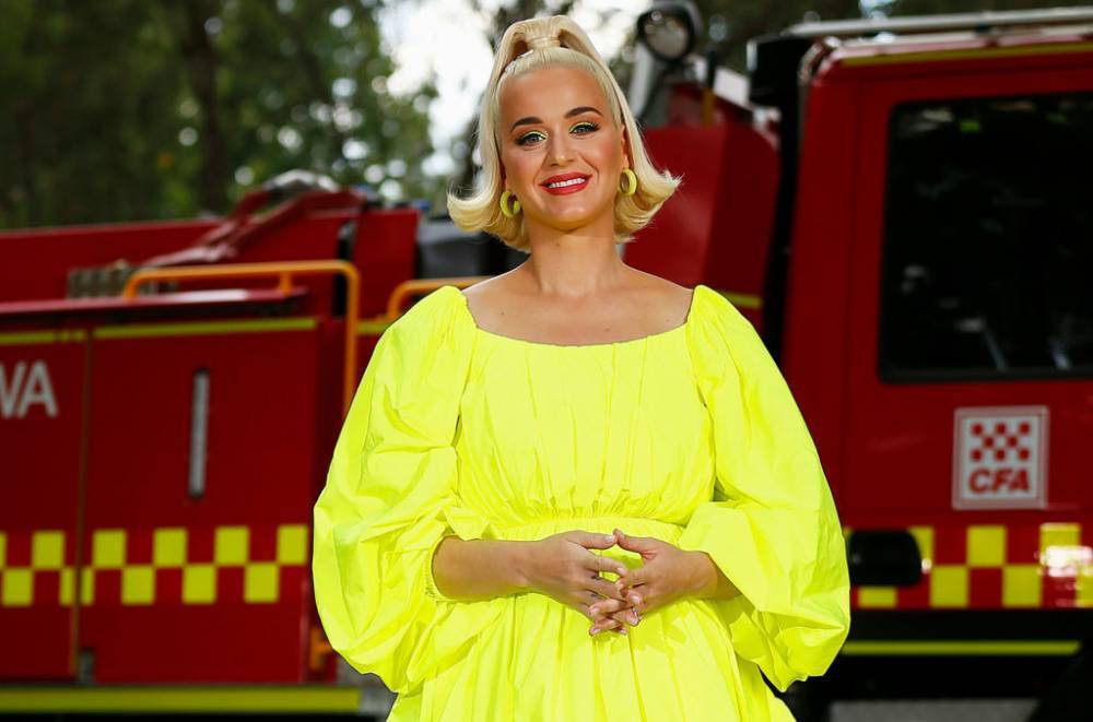 Katy Perry Shows Off Baby Bump in Neon Green Mini-Dress at Australian Benefit Concert - www.billboard.com - Australia