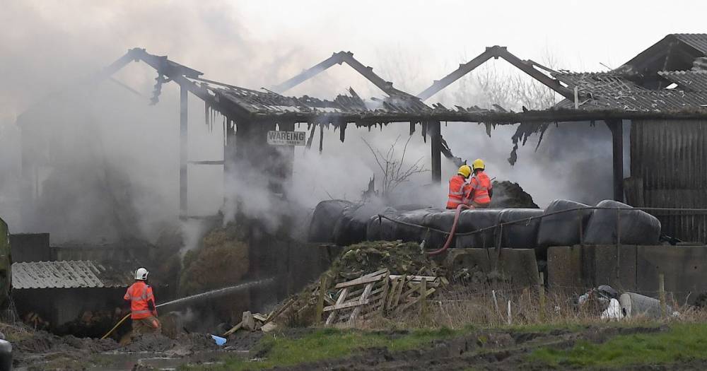 Residents told to keep windows and doors shut as firefighters tackle large blaze at a farm in Bolton - www.manchestereveningnews.co.uk