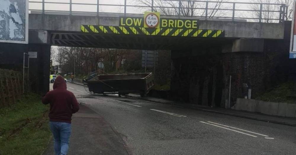 The tipper from a lorry has detached under a railway bridge causing delays in Stockport - www.manchestereveningnews.co.uk - Manchester