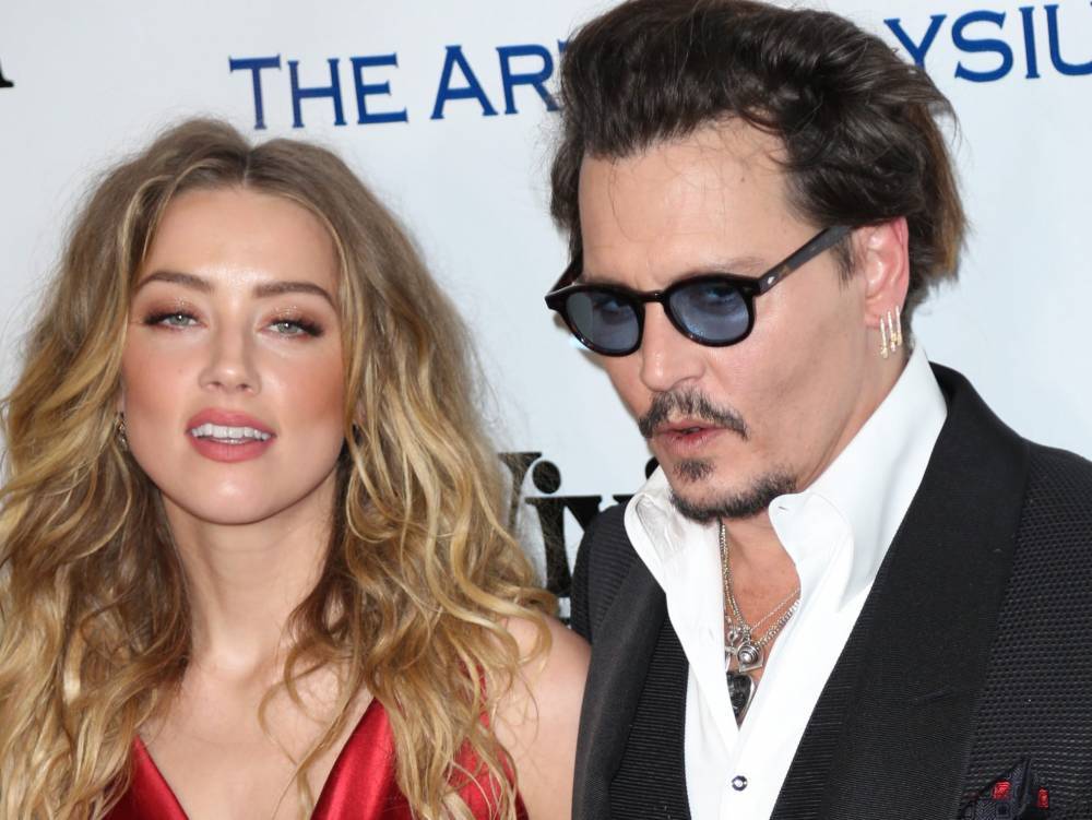 'I DID NOT MEAN TO': Amber Heard hit Johnny Depp 'with the door' - torontosun.com - New York