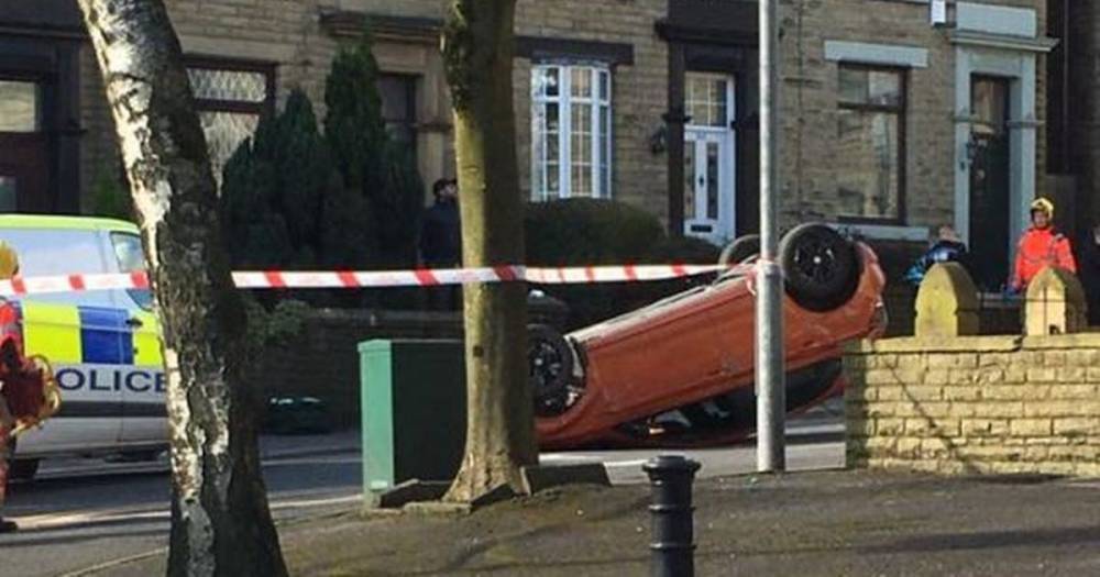 Man and woman arrested after car flipped on to roof following smash in Oldham - www.manchestereveningnews.co.uk - county Oldham