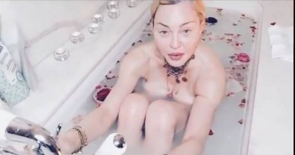 Madonna says coronavirus is 'the great equalizer' in bizarre video of herself nude in the bathtub - www.manchestereveningnews.co.uk