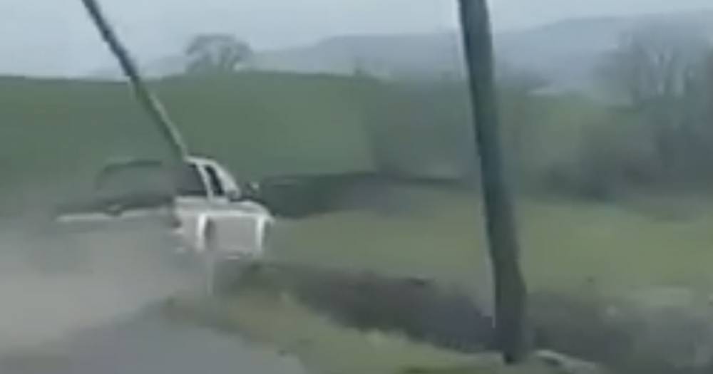 Dramatic footage shows pickup truck lose control and plunge off country road - www.dailyrecord.co.uk