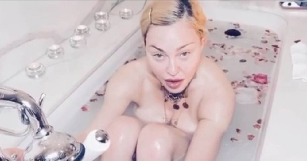 Madonna slammed for praising coronavirus for being 'the great equaliser' in bizarre naked bath video - www.ok.co.uk