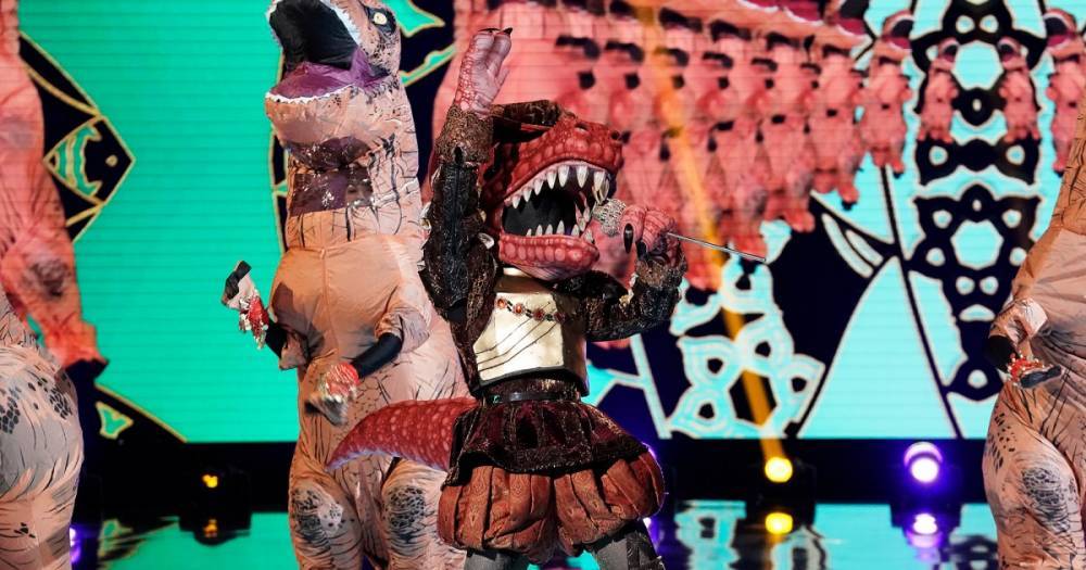 ‘The Masked Singer’ Playoffs: Did You Guess the T-Rex’s Identity? - www.usmagazine.com