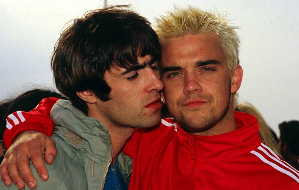 Robbie Williams reignites feud with Liam Gallagher following self-isolation - www.nme.com