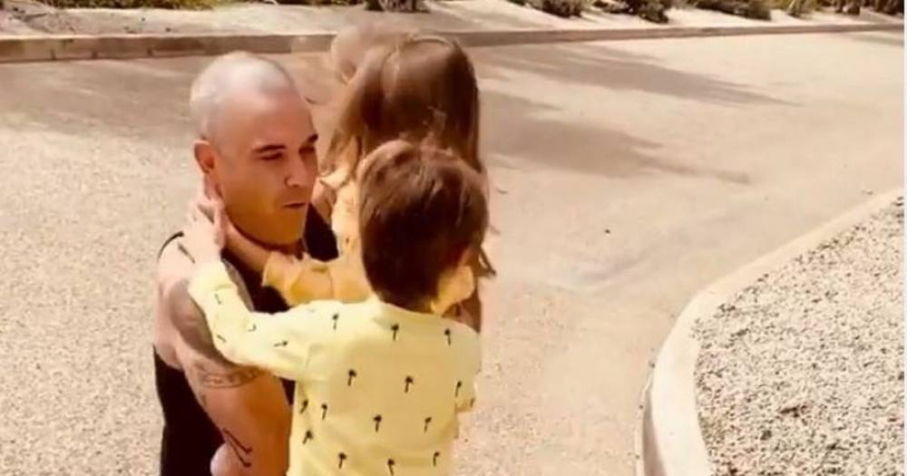 The emotional moment Robbie Williams is reunited with his wife and children after three week quarantine - www.manchestereveningnews.co.uk - Australia