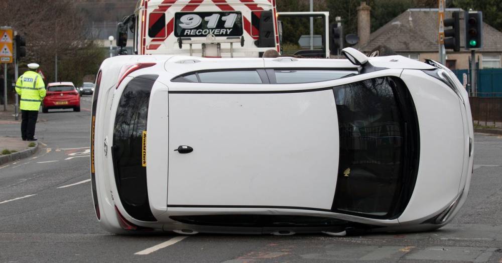 Car flips over after crash in Edinburgh sparking emergency response - www.dailyrecord.co.uk