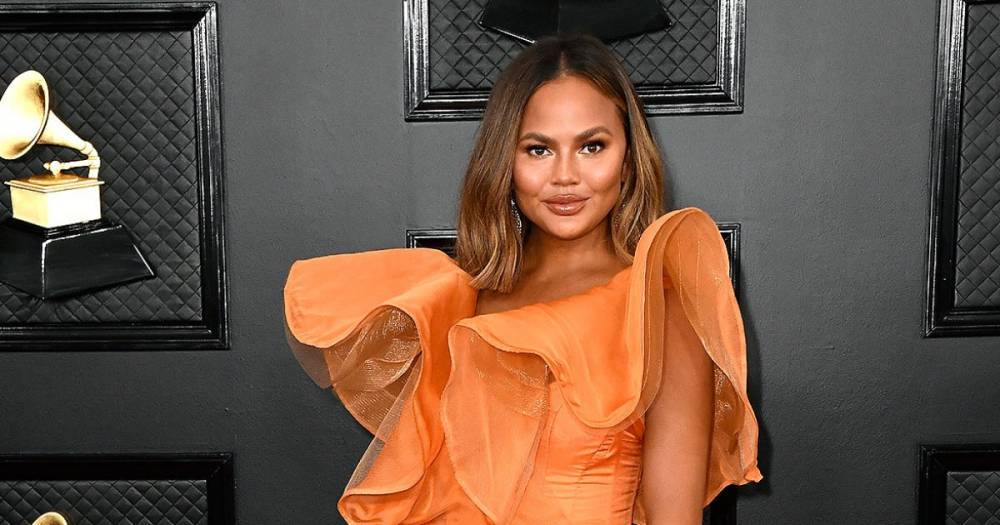 Chrissy Teigen Candidly Reveals She Has Breast Implants — But Says She Wants 'Them Out Now' - flipboard.com - Britain