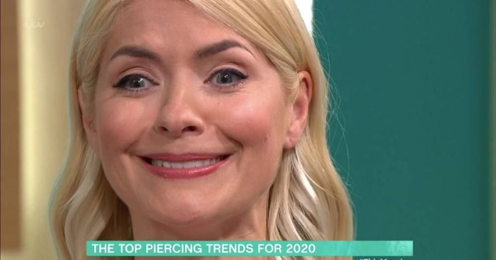Holly Willoughby squeals with pain as she has her ears pierced live on This Morning - www.ok.co.uk