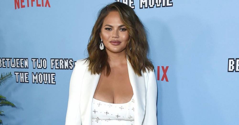 Chrissy Teigen Reveals the Reason Why She Got Breast Implants in Her 20s: ‘I Want Them Out Now’ - www.usmagazine.com - Britain